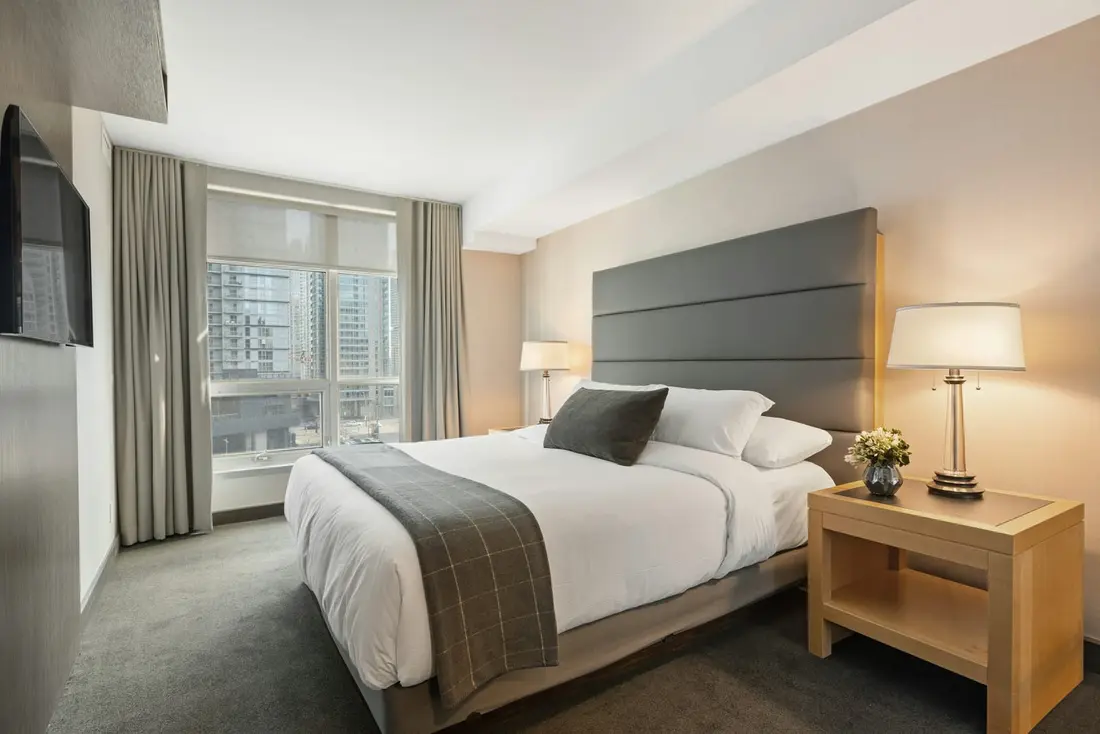 A bright guest room overlooking the city